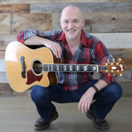Dave Milliken with his Yamaha acoustic guitar
